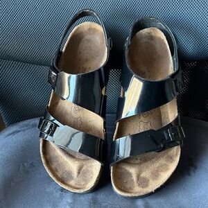 Birkenstock Glossy Black Sandals. The size is 41 or 26.5 or W10 M8.